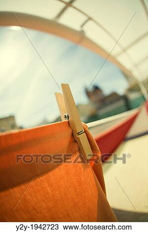 Clothespin with orange sheet. Foios, Valencia province, Comunidad Valenciana, Spain View Large Photo Image Stock Image - Clothespin with orange sheet. Foios, Valencia province, Comunidad Valenciana, Spain. Fotosearch