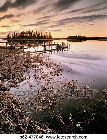 Clouds After Sunset, Grasses and Water Pump Dock, Astotin Lake, Elk Island National Park, Alberta, Canada View Large Photo Image Stock Photograph - Clouds After Sunset, Grasses and Water Pump Dock, Astotin Lake, Elk Island National Park, Alberta, Canada. Fotosearch