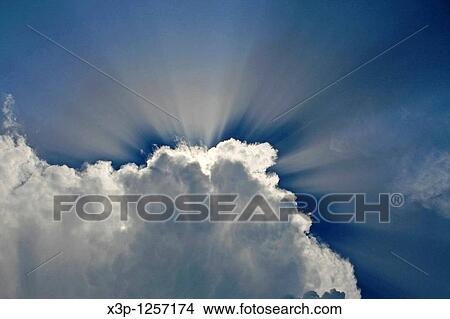 Picture - Clouds and sunrays. Fotosearch