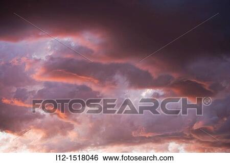 Clouds at sunset View Large Photo Image Stock Photograph - Clouds at sunset. Fotosearch