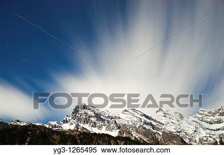 Clouds moving over Bernese alps in winter, Gimmelwald, Switzerland View Large Photo Image Stock Photography - Clouds moving over Bernese alps in winter, Gimmelwald, Switzerland. Fotosearch