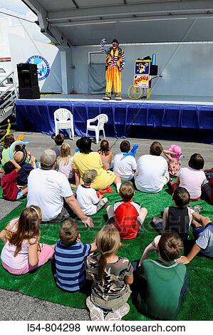 Clown entertains children Yale Michigan Bologna festival View Large Photo Image Stock Photo - Clown entertains children Yale Michigan Bologna festival. Fotosearch