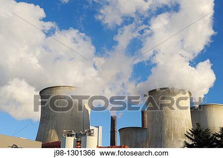 Coal fired power station Niederaussem emitting steam and smoke from cooling tower and smokestack, close up View Large Photo Image Stock Photograph - Coal fired power station Niederaussem emitting steam and smoke from cooling tower and smokestack, close up. Fotosearch