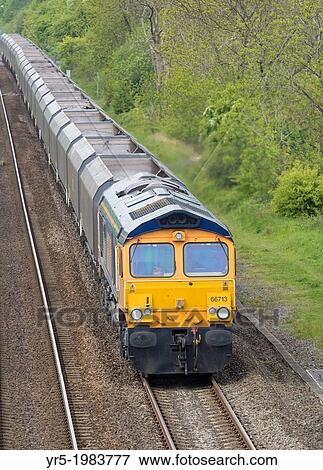 Stock Photo - Coal freight train transporting imported coal to Drax power station in Yorkshire from The Port of Tyne at Newcastle, England, UK.. Fotosearch