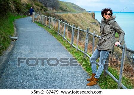 Stock Photo - Coastal walk and woman. Cobaron. Muskiz, Biscay, Basque Country, Spain, Europe.. Fotosearch
