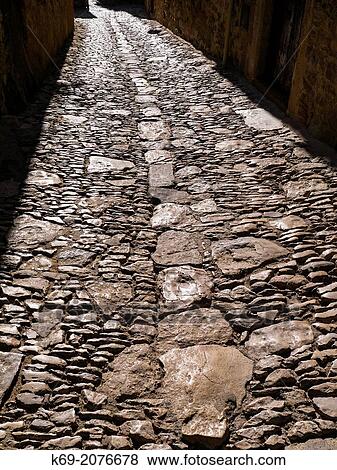 Cobblestoned Street. Peratallada. Girona. Spain. View Large Photo Image Stock Photo - Cobblestoned Street. Peratallada. Girona. Spain.. Fotosearch