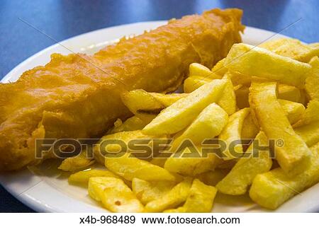 Cod and chips at a chippy in Birmingham England UK Europe View Large Photo Image Stock Photo - Cod and chips at a chippy in Birmingham England UK Europe. Fotosearch