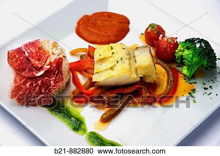 Cod fish with Iberian ham and red peppers salad at Barbacoa Andaluza restaurant, Mijas. Malaga province, Andalusia, Spain View Large Photo Image Stock Image - Cod fish with Iberian ham and red peppers salad at Barbacoa Andaluza restaurant, Mijas. Malaga province, Andalusia, Spain. Fotosearch