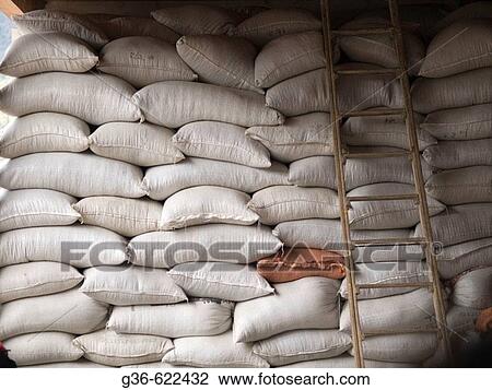 Stock Image - Coffee berries in bags waiting to be processed in a coffee mill outside of Antigua, Guatemala. Fotosearch