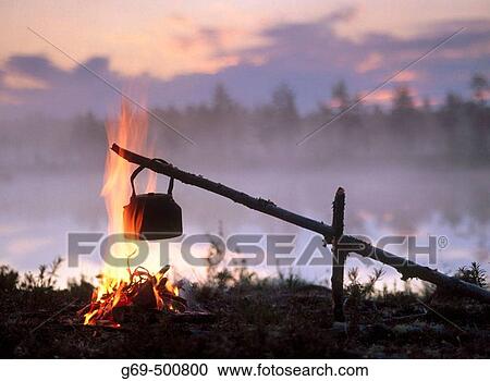 Coffee boiling over a campfire, at sunrise. Byske. Vasterbotten. Sweden. View Large Photo Image Stock Image - Coffee boiling over a campfire, at sunrise. Byske. Vasterbotten. Sweden.. Fotosearch