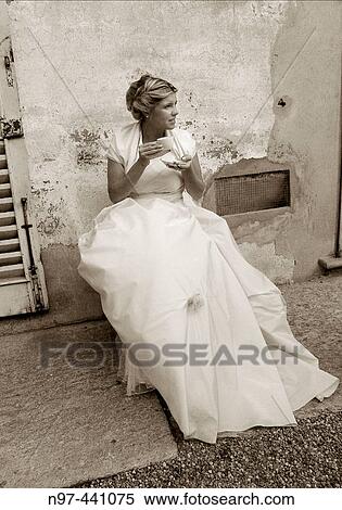 Coffee break during her wedding View Large Photo Image Stock Photography - Coffee break during her wedding. Fotosearch