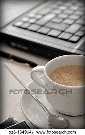 Stock Photo - Coffee cup and Laptop computer. Fotosearch