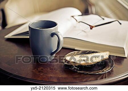 Coffee mug on a table. View Large Photo Image Stock Photography - Coffee mug on a table.. Fotosearch
