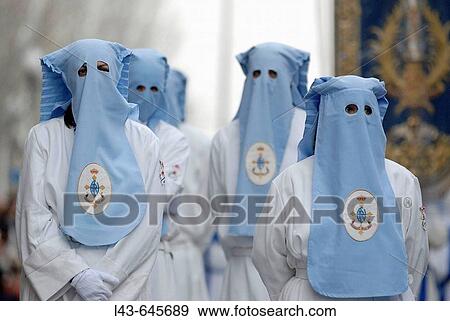 Stock Photo - Cofrades (brotherhood members). Real Hermandad de Cristo Resucitado y Santa Mar? a de la Esperanza y del Consuelo, Holy Week procession, Zaragoza, Spain. Fotosearch