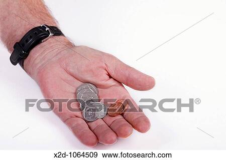 Coins in the palm of a man's hand Isolated Copy space View Large Photo Image Stock Photo - Coins in the palm of a man's hand Isolated Copy space. Fotosearch