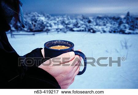 Cold hands around a hot cup of soup, Black Forest, Germany View Large Photo Image Stock Photo - Cold hands around a hot cup of soup, Black Forest, Germany. Fotosearch