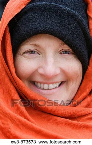 Stock Image - Cold smiling woman on rafting trip in Canyonlands National Park. Fotosearch