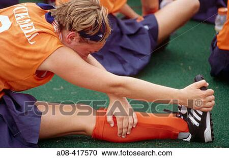 College field hockey player stretches before a match. Pennsylvania, USA View Large Photo Image Stock Image - College field hockey player stretches before a match. Pennsylvania, USA. Fotosearch