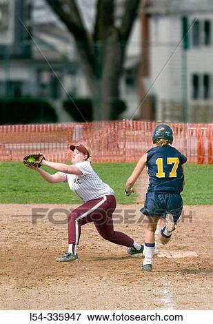College level female softball View Large Photo Image Stock Photo - College level female softball. Fotosearch