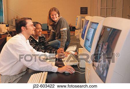 College professor and students in computer lab View Large Photo Image Stock Image - College professor and students in computer lab. Fotosearch