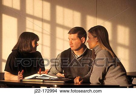 Picture - College professor and students talking. Fotosearch