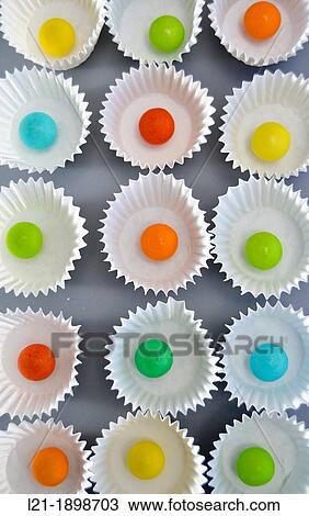 Colored balls into small paper cups curly white, gray background. View Large Photo Image Stock Image - Colored balls into small paper cups curly white, gray background.. Fotosearch