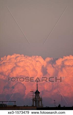 Stock Photo - Colored clouds behind the bell tower, Catarroja, Valencia. Fotosearch