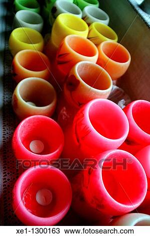 Stock Image - colored wax bowls.. Fotosearch