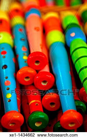 Stock Image - Colored wooden flutes. Fotosearch