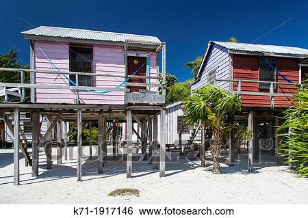 Colorful beach cottages on the island of Cay Caulker, Belize View Large Photo Image Stock Photograph - Colorful beach cottages on the island of Cay Caulker, Belize. Fotosearch