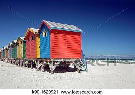 Colorful beach huts at the sandy beach of Muizenberg with blue sky, False Bay near Cape Town, South Africa View Large Photo Image Stock Image - Colorful beach huts at the sandy beach of Muizenberg with blue sky, False Bay near Cape Town, South Africa. Fotosearch