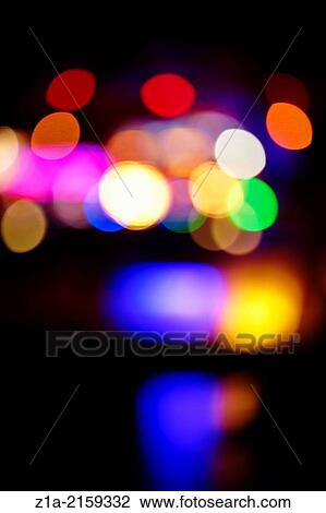 Stock Image - Colorful bokeh lights at night.. Fotosearch