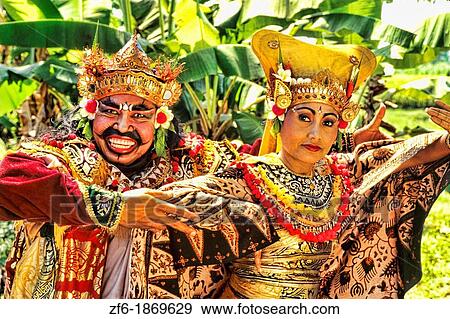 Colorful golden dancers in traditional dress with gestures in Bali Indonesia View Large Photo Image Stock Photo - Colorful golden dancers in traditional dress with gestures in Bali Indonesia. Fotosearch