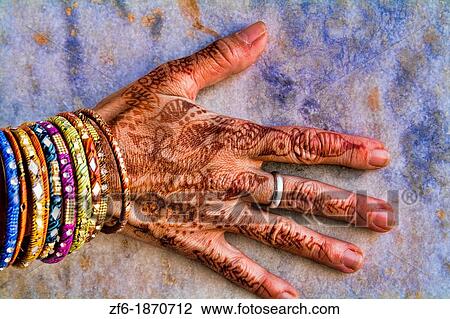 Colorful Henna design on womans hands artwork for celebration tatoos in Delhi India View Large Photo Image Stock Image - Colorful Henna design on womans hands artwork for celebration tatoos in Delhi India. Fotosearch
