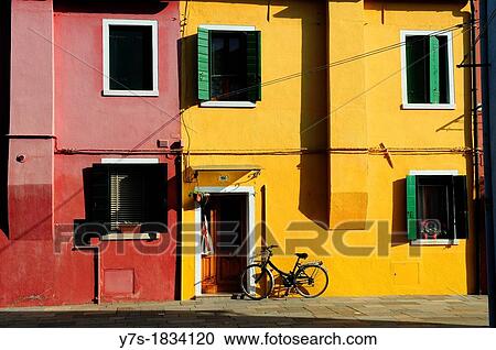 Colorful houses in a row beside Burano's Grand Canal in the island of Burano near Venice, Italy, Europe View Large Photo Image Stock Image - Colorful houses in a row beside Burano's Grand Canal in the island of Burano near Venice, Italy, Europe. Fotosearch