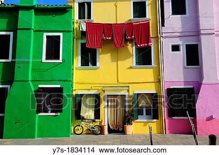 Picture - Colorful houses with hanging laundry in the island of Burano near Venice, Italy, Europe. Fotosearch