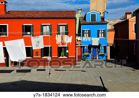 Colorful houses with hanging laundry in the island of Burano near Venice, Italy, Europe View Large Photo Image Picture - Colorful houses with hanging laundry in the island of Burano near Venice, Italy, Europe. Fotosearch
