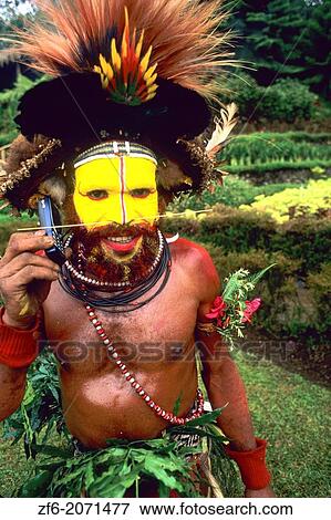 Colorful Huli Wigman of Papua New Guinea On Cell Phone. View Large Photo Image Stock Photo - Colorful Huli Wigman of Papua New Guinea On Cell Phone.. Fotosearch
