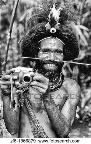 Colorful Huli Wigmen of Papua New Guinea with Digital Camera View Large Photo Image Stock Photo - Colorful Huli Wigmen of Papua New Guinea with Digital Camera. Fotosearch