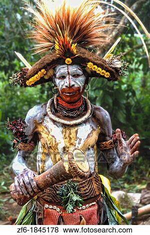 Colorful Huli Wigmen w/ Painted Face In Papua New Guinea View Large Photo Image Stock Photo - Colorful Huli Wigmen w/ Painted Face In Papua New Guinea. Fotosearch