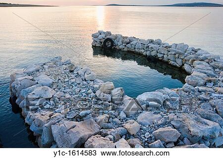 Colorful late sunlight in a very small harbor, Pag island in Croatia View Large Photo Image Stock Image - Colorful late sunlight in a very small harbor, Pag island in Croatia. Fotosearch