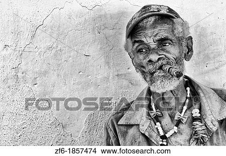 Colorful local man on yellow wall in colorful Trinidad Cuba Colonial city View Large Photo Image Picture - Colorful local man on yellow wall in colorful Trinidad Cuba Colonial city. Fotosearch