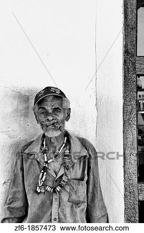 Colorful local man on yellow wall in colorful Trinidad Cuba Colonial city View Large Photo Image Stock Image - Colorful local man on yellow wall in colorful Trinidad Cuba Colonial city. Fotosearch