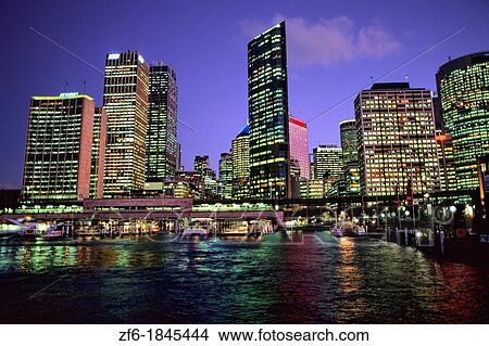 Picture - Colorful night time graphic sunset of Sydney Skyline from Circular Quay in New South Wales Australia. Fotosearch