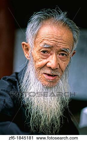 Stock Image - Colorful portrait of artist at Ghost City in Gengdu in China. Fotosearch