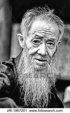 Stock Image - Colorful portrait of artist at Ghost City in Gengdu in China. Fotosearch
