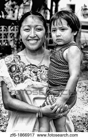 Colorful portrait of local native with her child in Cancun Mexico View Large Photo Image Stock Photo - Colorful portrait of local native with her child in Cancun Mexico. Fotosearch