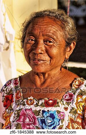 Colorful portrait of local vendor in the Chichen Itza area of Mexico View Large Photo Image Stock Photo - Colorful portrait of local vendor in the Chichen Itza area of Mexico. Fotosearch