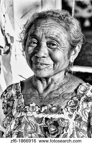 Stock Photograph - Colorful portrait of local vendor in the Chichen Itza area of Mexico. Fotosearch