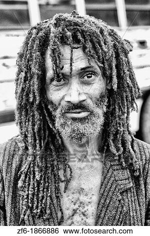 Stock Photograph - Colorful portrait of native man with dreadlocks in Belize. Fotosearch